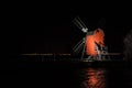Red old traditional windmill by night Royalty Free Stock Photo