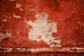 Red old wall. abstract background texture concrete wall. Paint peels from the surface of the wall. Royalty Free Stock Photo