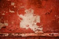 Red old wall. abstract background texture concrete wall. Paint peels from the surface of the wall.