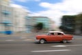 Red oldtimer car running in Havana street, Cuba Royalty Free Stock Photo