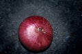 Red onion in black background
