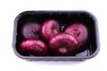 Red onion bulbs isolated on a white background. Red onions plastic container. Healthy food. Lilac onion. Purple onion Royalty Free Stock Photo