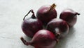 Red onion bulbs on white table Royalty Free Stock Photo