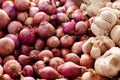Red onion and garlic display on fresh market table