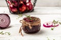 Red onion marmalade jam confiture in jar. Vegetable jam on white wooden background. Delicious sauce. Gourmet Royalty Free Stock Photo