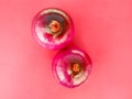 Red onion tuber isolated on pink