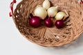 Red onion and white onion brown wicker basket Royalty Free Stock Photo