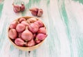 Red onion in wooden bowl Royalty Free Stock Photo