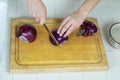 Red Onions being sliced on kitchen cutting board Royalty Free Stock Photo