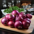 Red onions on a cutting board with spices and herbs on a wooden table Royalty Free Stock Photo