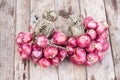 Red onions group on grunge texture wooden background Royalty Free Stock Photo