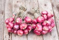 Red onions group on grunge texture wooden background Royalty Free Stock Photo