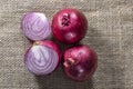 Red onions on jute background Royalty Free Stock Photo