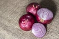 Red onions on jute background Royalty Free Stock Photo