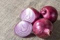 Red onions on jute background Royalty Free Stock Photo