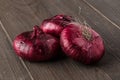 Red onions on rustic wood