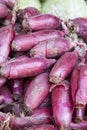 Red onions sold in traditional market Royalty Free Stock Photo