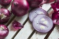 Red Onions on a rustic wooden borad