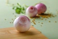 Red onions on wooden board Royalty Free Stock Photo
