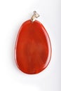 Red onyx pendant isolated on white background Royalty Free Stock Photo