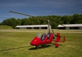 Red open-cockpit autogyro