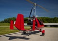 Red open-cockpit autogyro