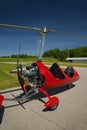 Red open-cockpit autogyro