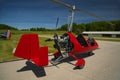 Red open-cockpit autogyro