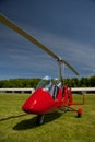 Red open-cockpit autogyro