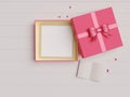 Red open gift box with empty picture frame and ribbon with empty space. Top view. 3D rendering Royalty Free Stock Photo