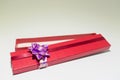 Red open gift box isolated with purple blow