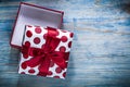 Red opened gift box on wooden board holidays concept Royalty Free Stock Photo