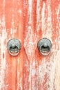 A red opened old door with beautiful bronze retro style carved f Royalty Free Stock Photo
