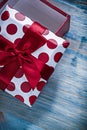 Red opened wrapped giftbox on wooden board holidays concept Royalty Free Stock Photo