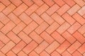 Red-Orange bricks tiled floor with zigzag pattern texture background Royalty Free Stock Photo