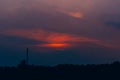 The red-orange clouds of the evening sky at sunset are bright Royalty Free Stock Photo