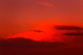 Red orange epic dramatic scary mystical sunset sky with clouds, bright colorful sky landscape background