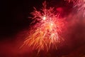 Red and orange fireworks against the backdrop of the night sky Royalty Free Stock Photo