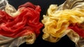 Red, Orange, and Golden Fabric Flowing Elegantly on a Black Background, Abstract Texture and Design Royalty Free Stock Photo