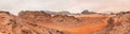 Red orange Mars like landscape in Jordan Wadi Rum desert, mountains background, overcast morning. This location was used as set Royalty Free Stock Photo