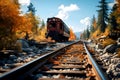 Red and orange old railway abandoned in the forest on the branches against the background of the turquoise sky Royalty Free Stock Photo