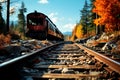 Red and orange old railway abandoned in the forest on the branches against the background of the turquoise sky Royalty Free Stock Photo