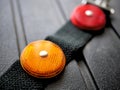 Red and orange safety light reflectors for biking, camping, road safety. Royalty Free Stock Photo