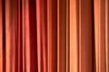 Red and orange silk curtain background.