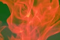 Abstract red orange smoke on a dark background, flames. Fire design and the concept of darkness, burning. Royalty Free Stock Photo