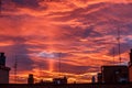 Red and orange sunset in a city, rich in dark clouds Royalty Free Stock Photo