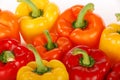 Red orange yellow bell peppers closeup