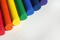 Red, orange, yellow, green, blue, indigo, purple. Rainbow colored crayons are placed side by side. Royalty Free Stock Photo