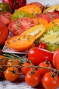 Assortment of sliced and whole tomatoes Royalty Free Stock Photo