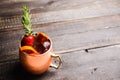 Red oranges and strawberry cocktail in copper mug variation of Moscow mule on the wooden background Royalty Free Stock Photo